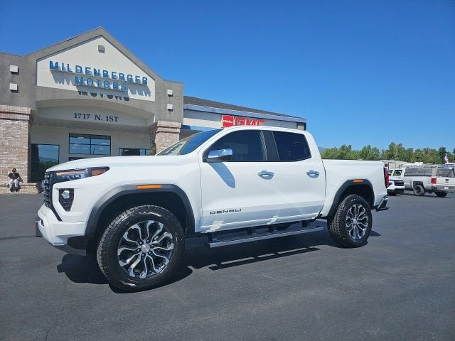 2026 GMC Canyon Denali in Summit White — front three-quarter view